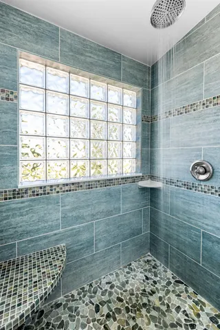 a view of a livingroom with a ceiling fan and window