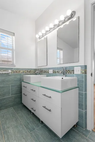 a bedroom with a large bed and a large window