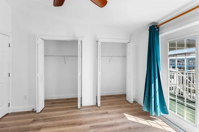 a bathroom with a sink a toilet and shower curtain