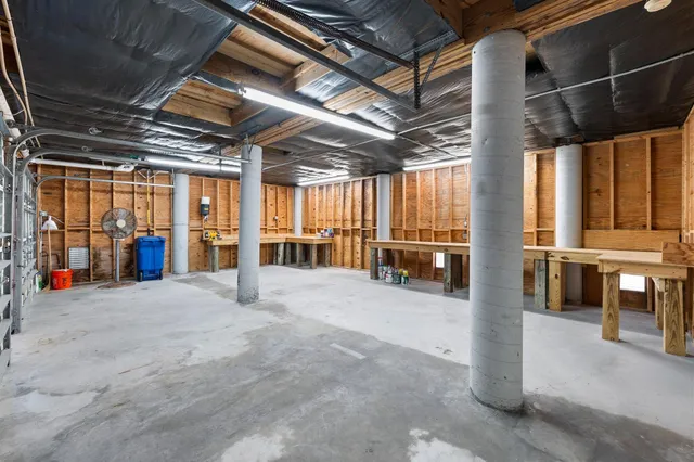a view of a swimming pool with a patio and a lake view