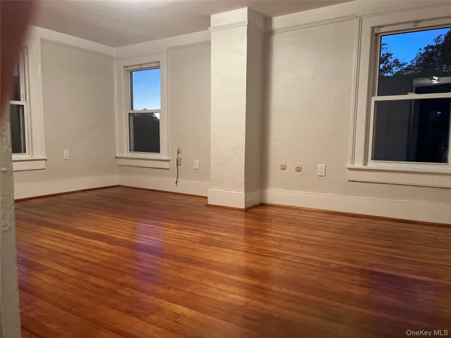 a white bath tub sitting next to a white toilet