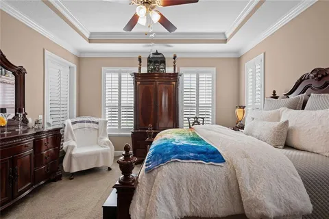 a bedroom with bed and window