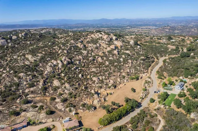 an aerial view of residential house and green space