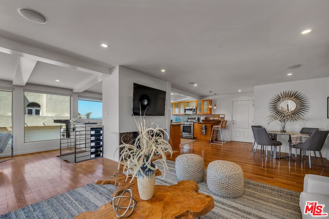 7328 Vista Del Mar Lane Playa del Rey, CA 90293 - Photo 11 of 56 a living room with lots of furniture and wooden floor