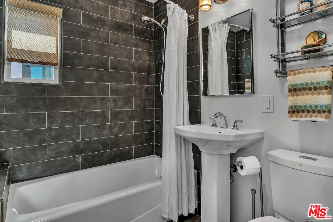 7328 Vista Del Mar Lane Playa del Rey, CA 90293 - Photo 22 of 56 a bathroom with a sink a toilet and shower