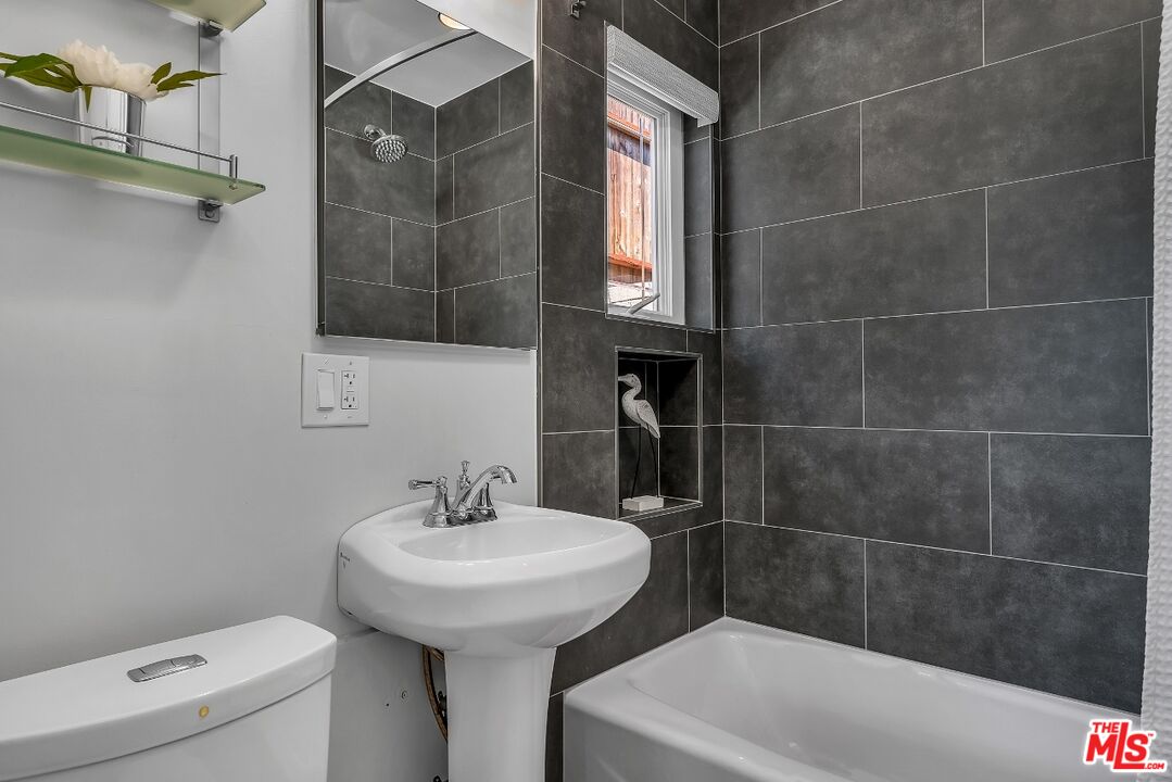 7328 Vista Del Mar Lane Playa del Rey, CA 90293 - Photo 29 of 56 a bathroom with a sink a toilet and shower