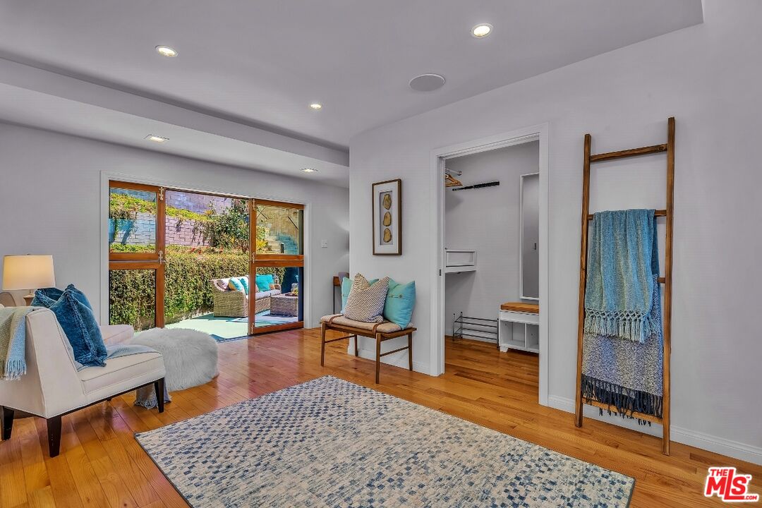 7328 Vista Del Mar Lane Playa del Rey, CA 90293 - Photo 30 of 56 a living room with furniture and a rug
