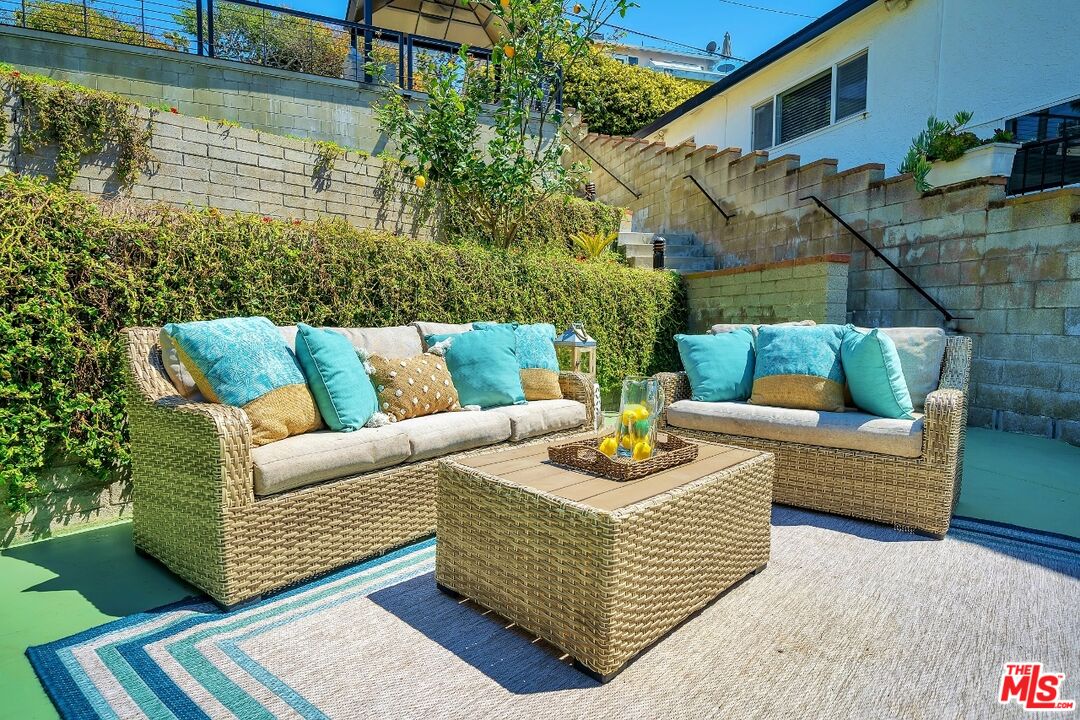 7328 Vista Del Mar Lane Playa del Rey, CA 90293 - Photo 34 of 56 a view of a patio with couches and a potted plant on a table