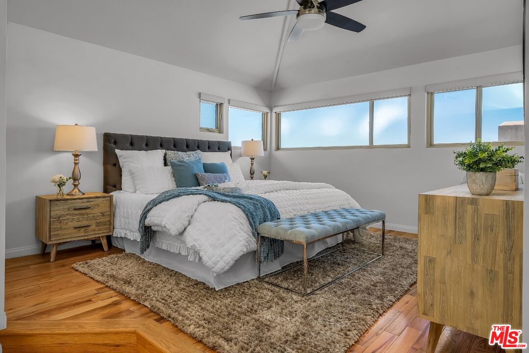 7328 Vista Del Mar Lane Playa del Rey, CA 90293 - Photo 35 of 56 a bedroom with a bed and wooden floor
