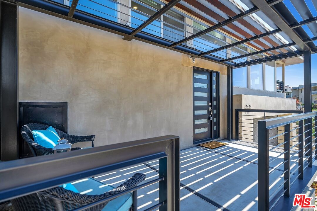 7328 Vista Del Mar Lane Playa del Rey, CA 90293 - Photo 4 of 56 a view of a hallway with wooden floor and staircase