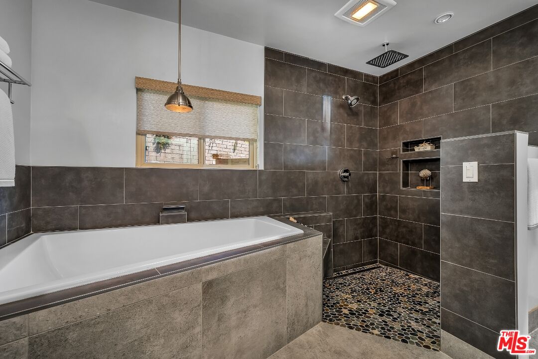7328 Vista Del Mar Lane Playa del Rey, CA 90293 - Photo 42 of 56 a bathroom with a bathtub and a shower