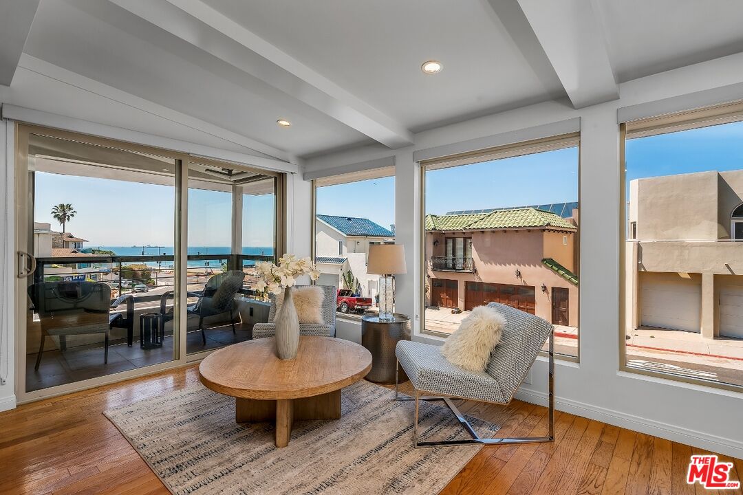 7328 Vista Del Mar Lane Playa del Rey, CA 90293 - Photo 7 of 56 a living room with furniture and a large window