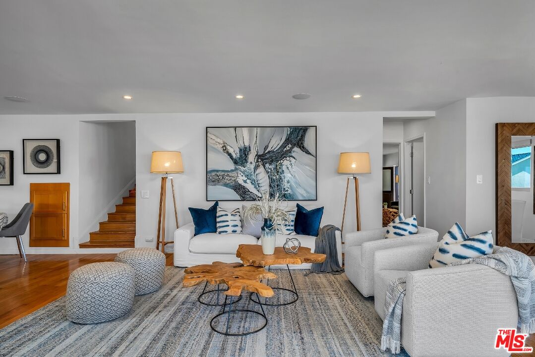 7328 Vista Del Mar Lane Playa del Rey, CA 90293 - Photo 10 of 56 a living room with furniture and a wooden floor