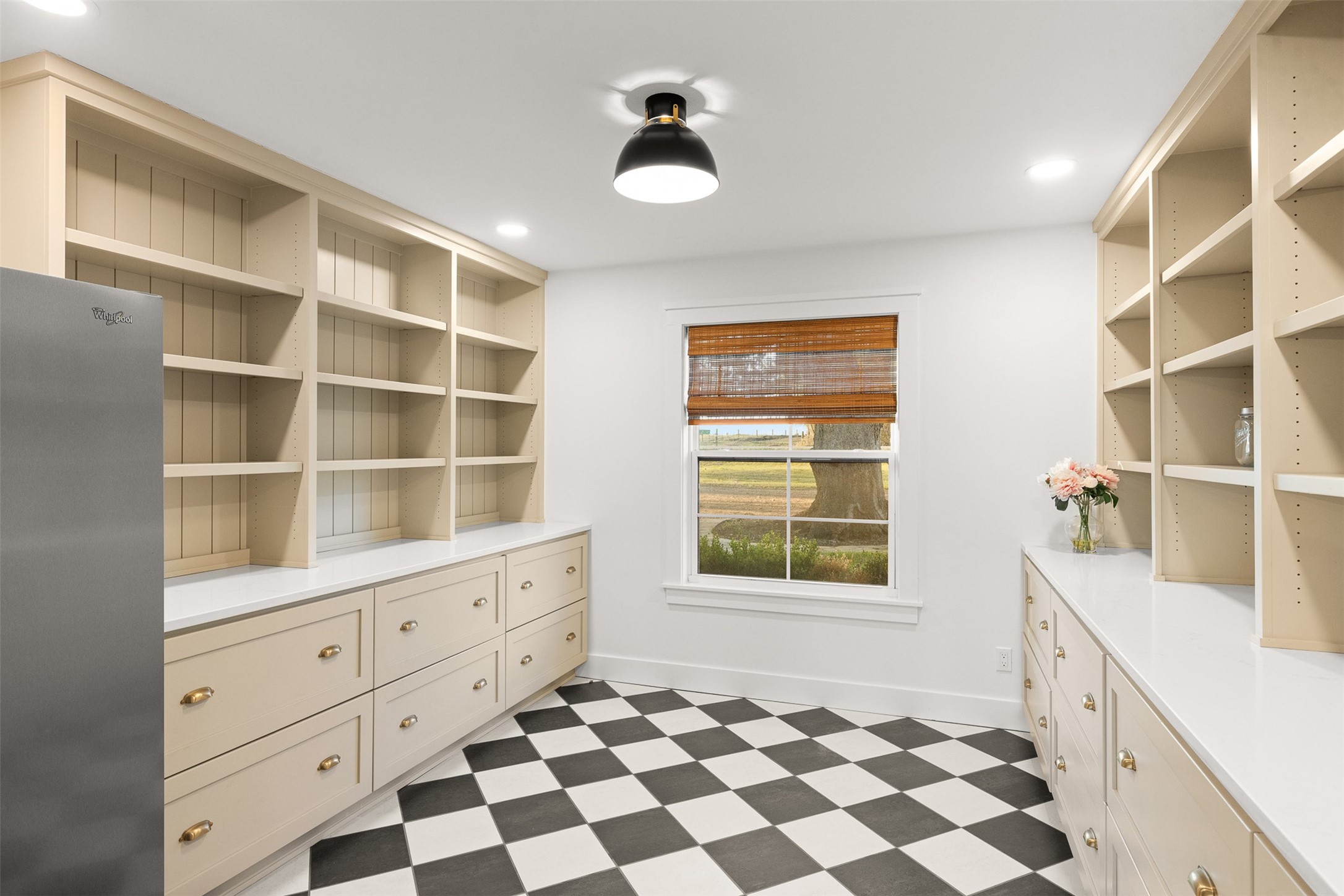 351 Pleasant Hill School Road Brenham, TX 77833 - Photo 12 of 46 a room with a black white checkered floor and a large window
