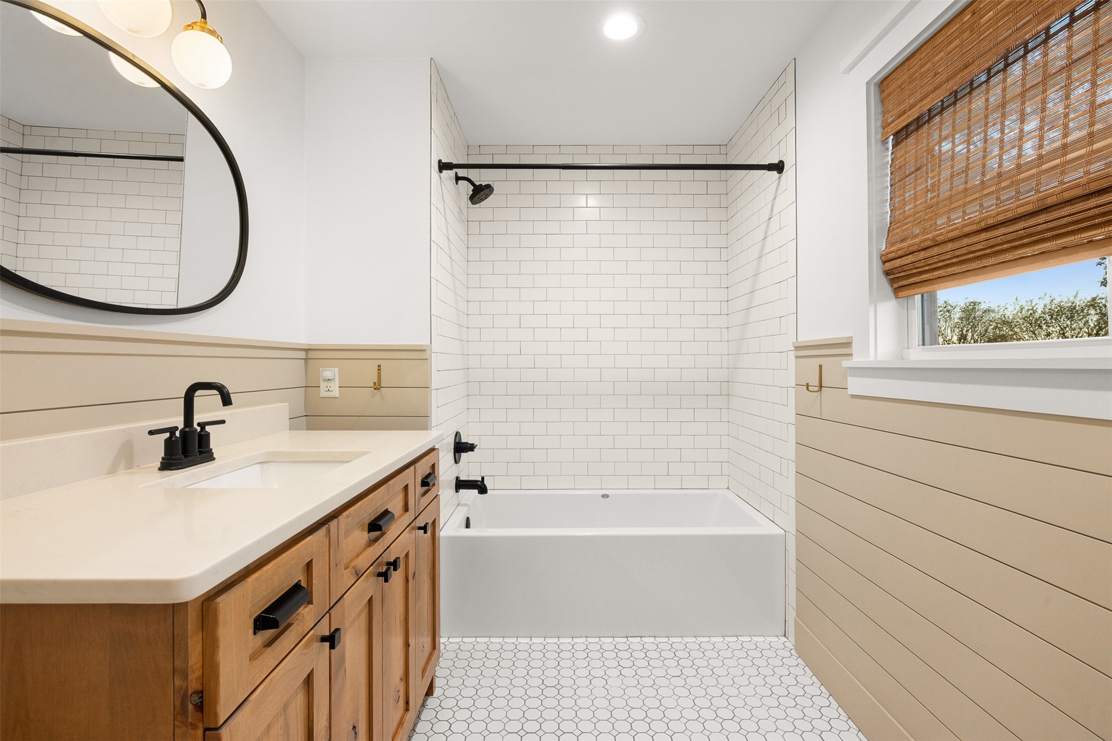 351 Pleasant Hill School Road Brenham, TX 77833 - Photo 17 of 46 a bathroom with a sink a vanity a mirror and a bathtub