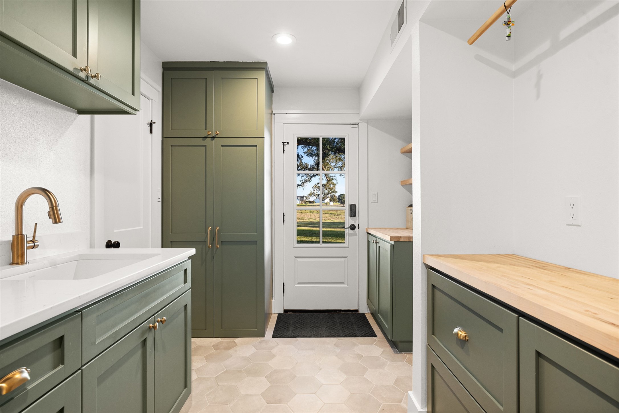 351 Pleasant Hill School Road Brenham, TX 77833 - Photo 23 of 46 a kitchen with a sink and a refrigerator
