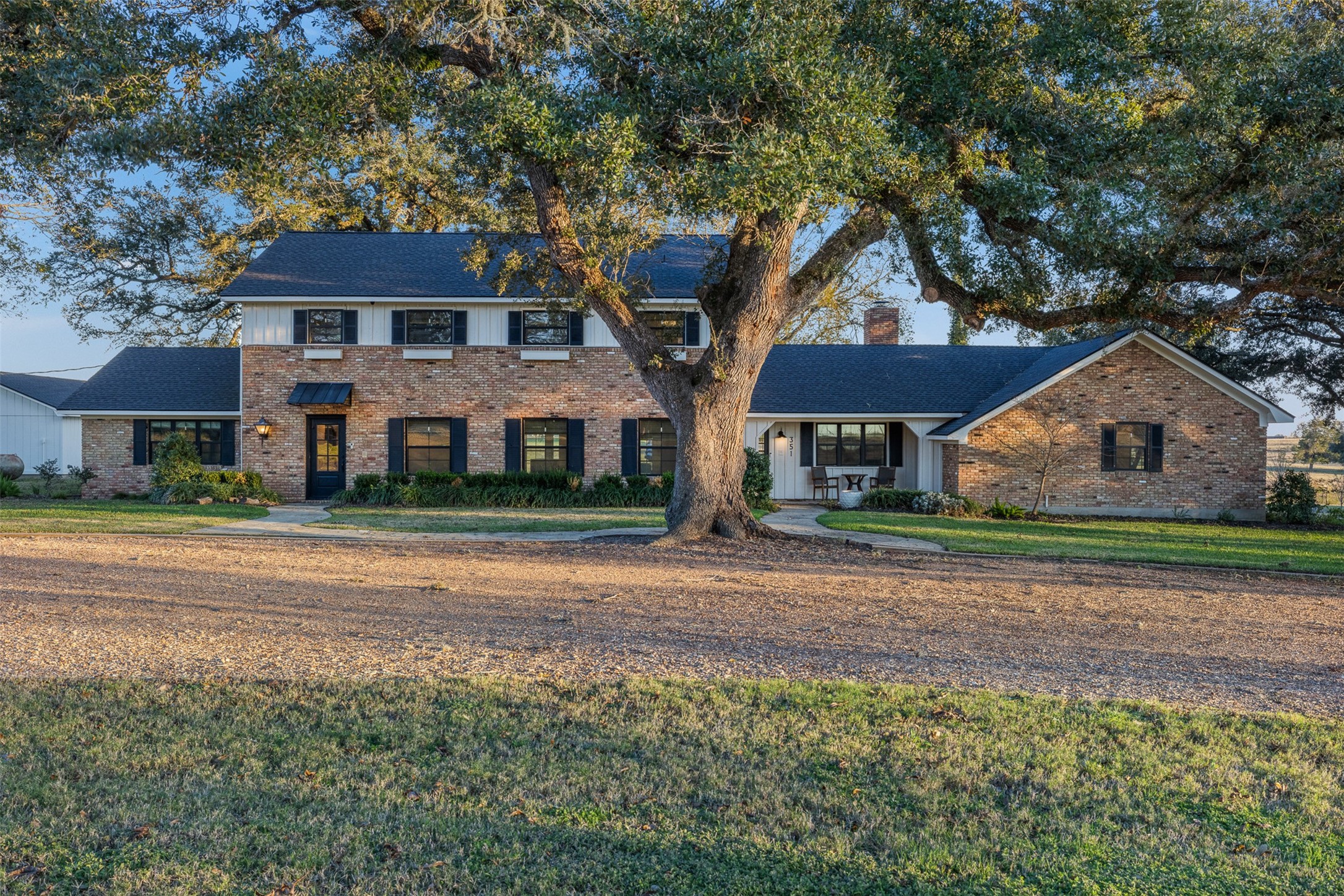 351 Pleasant Hill School Road Brenham, TX 77833 - Photo 33 of 46 a front view of house with yard and green space