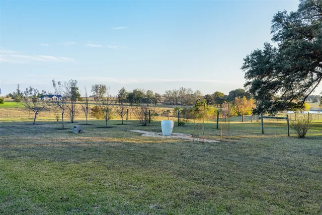 a view of a house with backyard and porch