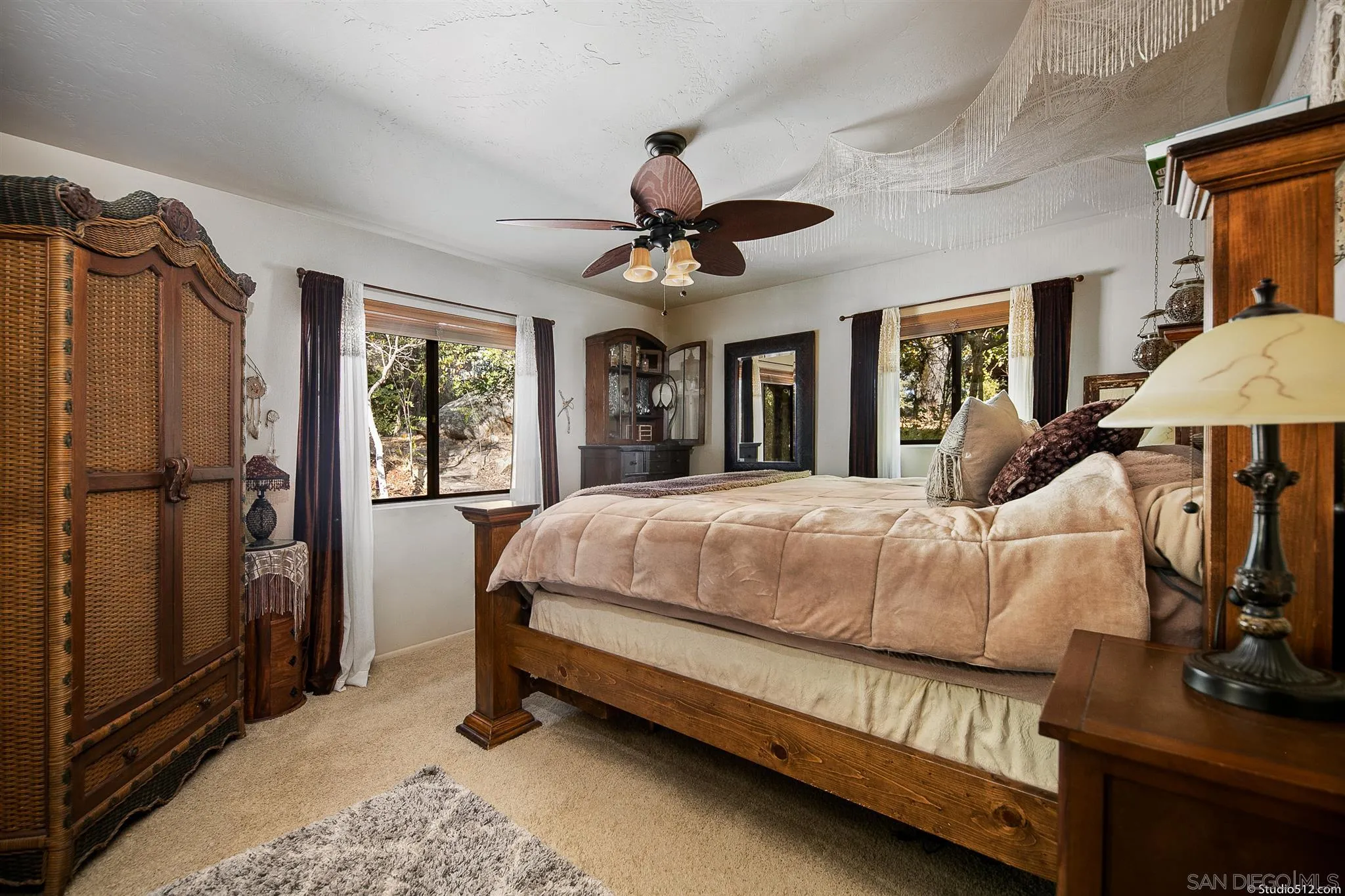 4944 Mountainbrook Road Santa Ysabel, CA 92070 - Photo 16 of 29 a bed room with a bed and a chandelier