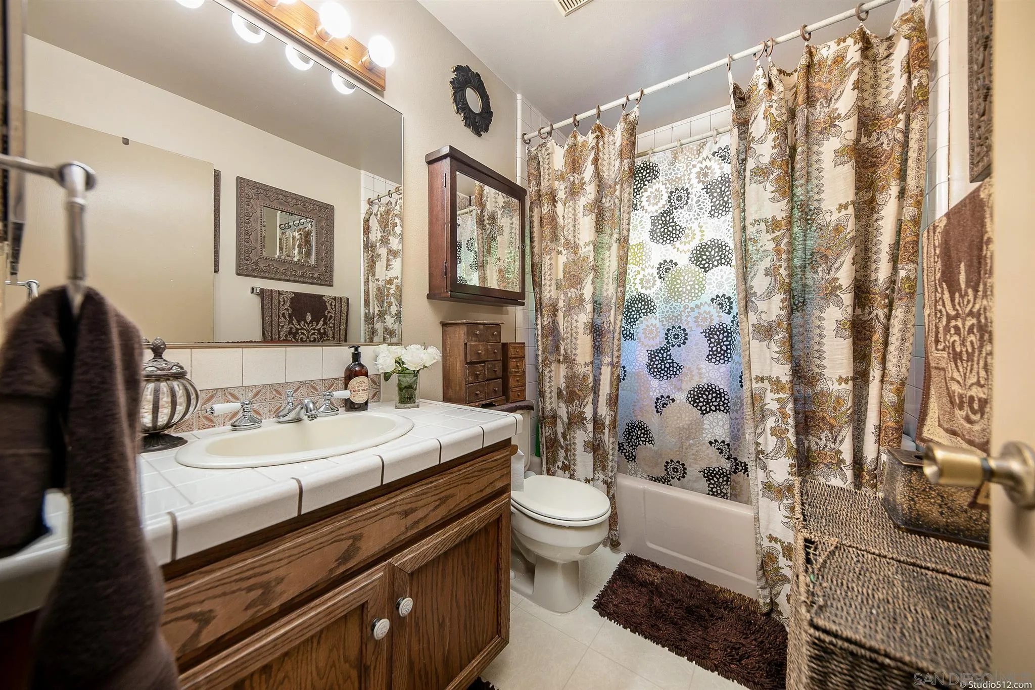 4944 Mountainbrook Road Santa Ysabel, CA 92070 - Photo 17 of 29 a bathroom with a double vanity sink toilet and shower
