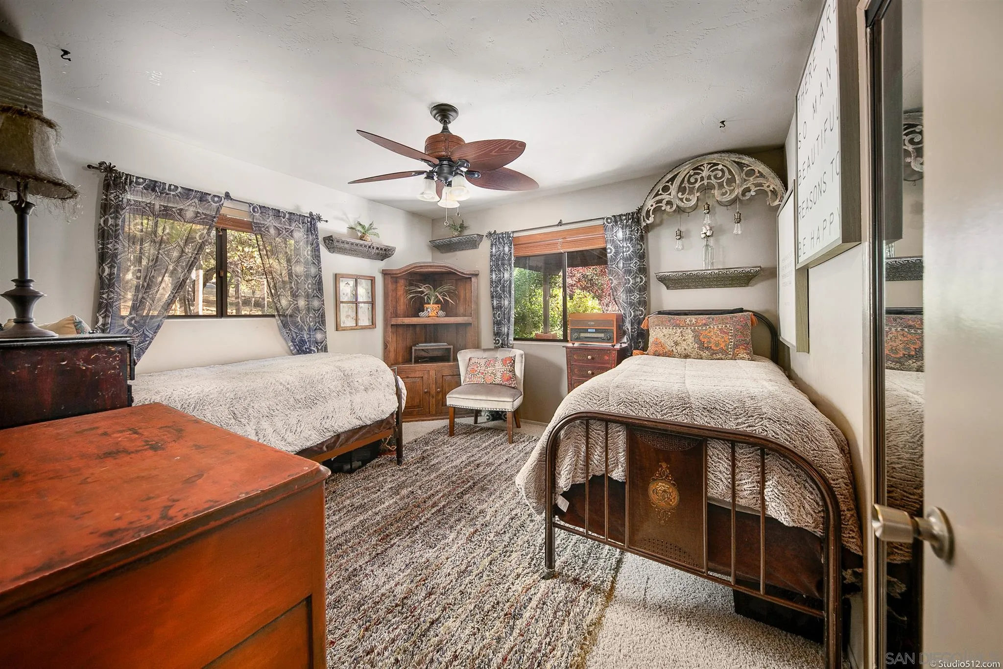 4944 Mountainbrook Road Santa Ysabel, CA 92070 - Photo 18 of 29 a bedroom with a bed a chandelier and dresser