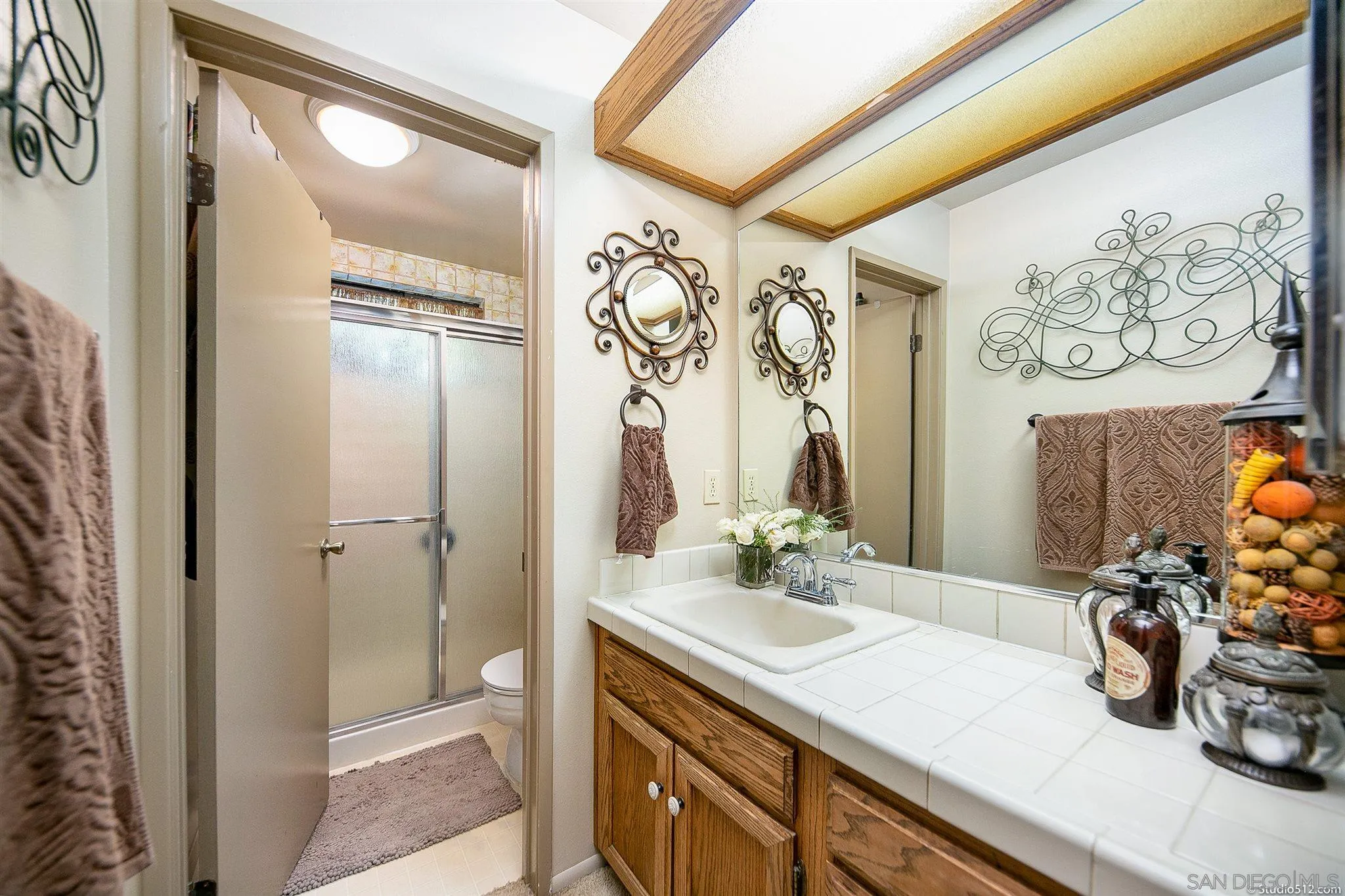 4944 Mountainbrook Road Santa Ysabel, CA 92070 - Photo 19 of 29 a bathroom with a granite countertop sink and a mirror