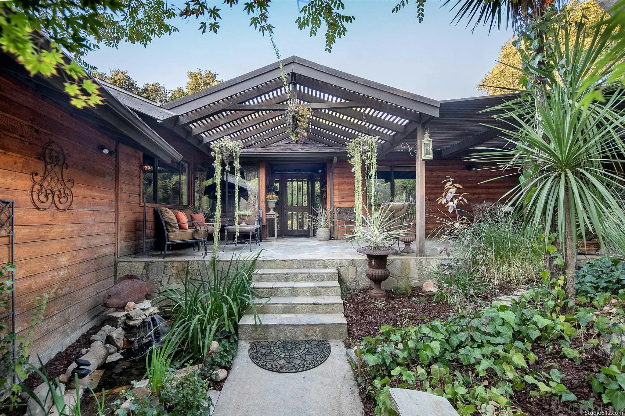 4944 Mountainbrook Road Santa Ysabel, CA 92070 - Photo 2 of 29 a view of a pathway that has potted plants