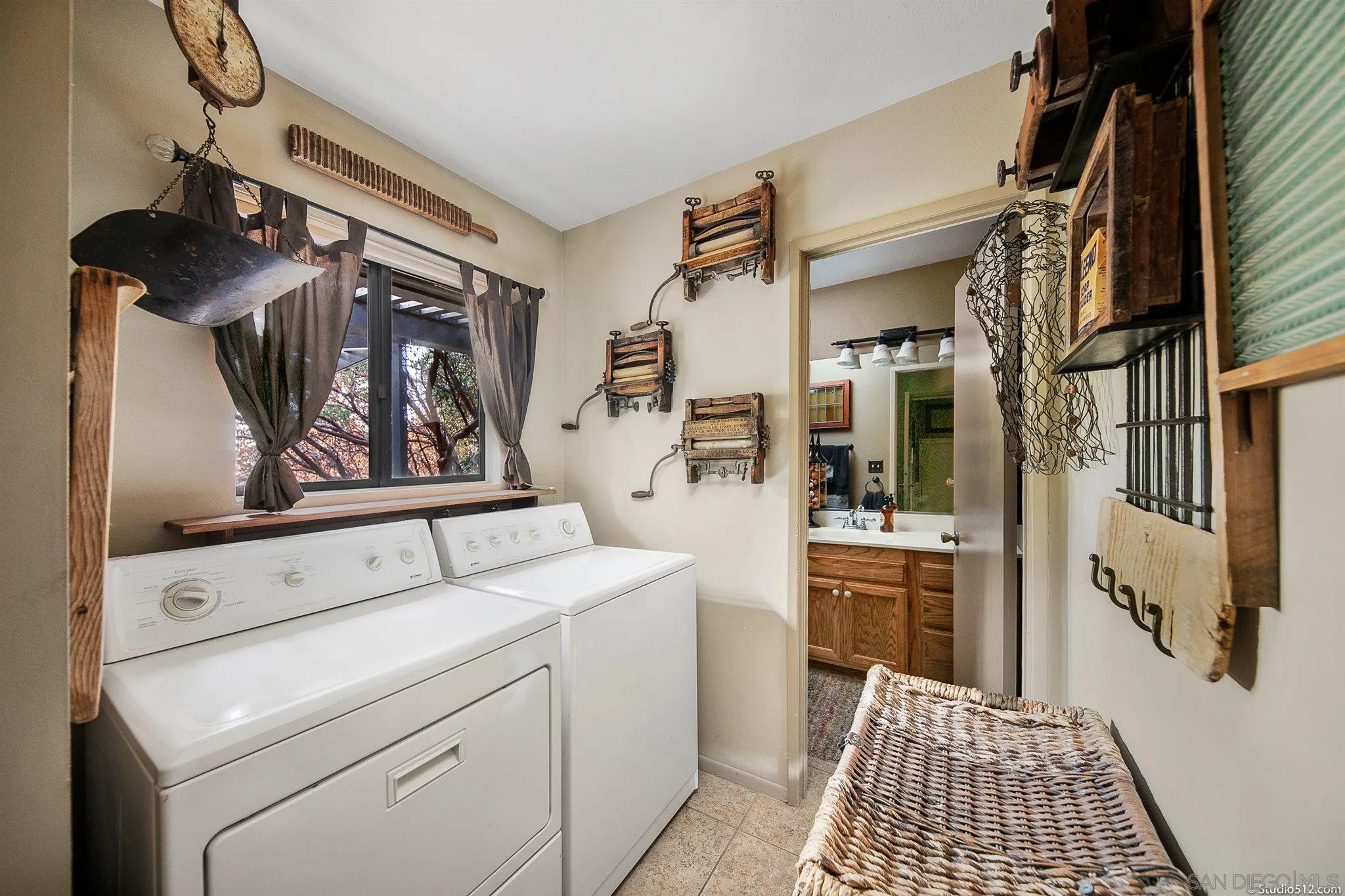 4944 Mountainbrook Road Santa Ysabel, CA 92070 - Photo 21 of 29 a view of washer and dryer with bathroom in the background