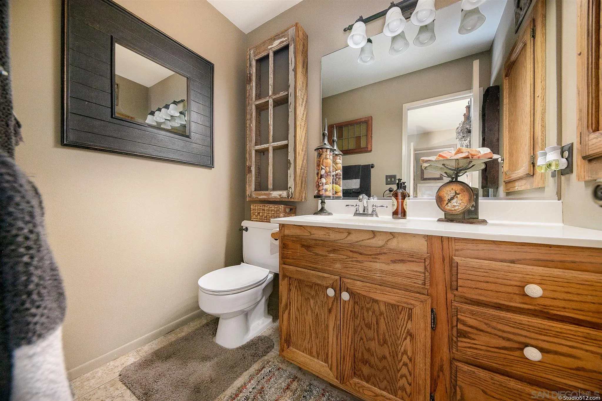 4944 Mountainbrook Road Santa Ysabel, CA 92070 - Photo 22 of 29 a bathroom with a toilet sink and mirror