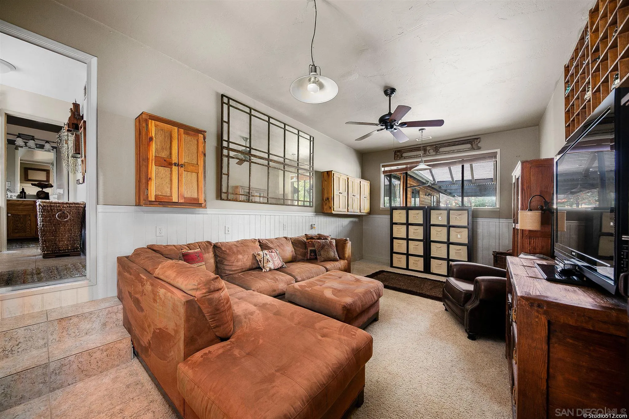 4944 Mountainbrook Road Santa Ysabel, CA 92070 - Photo 23 of 29 a living room with furniture a ceiling fan and a window