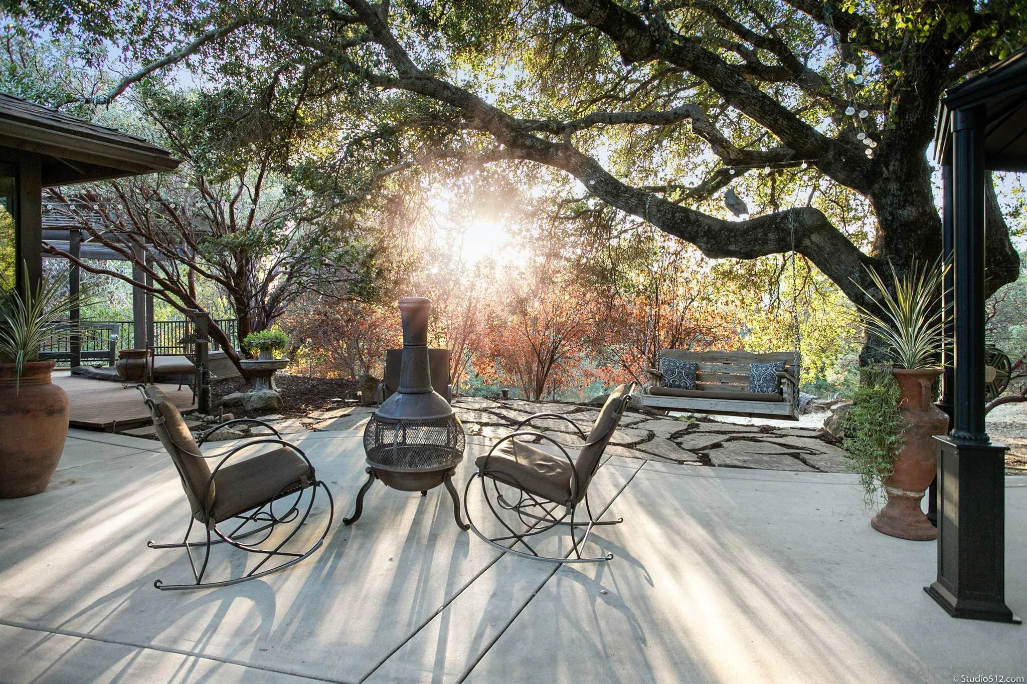 4944 Mountainbrook Road Santa Ysabel, CA 92070 - Photo 26 of 29 a view of a patio with table and chairs with wooden fence and floor