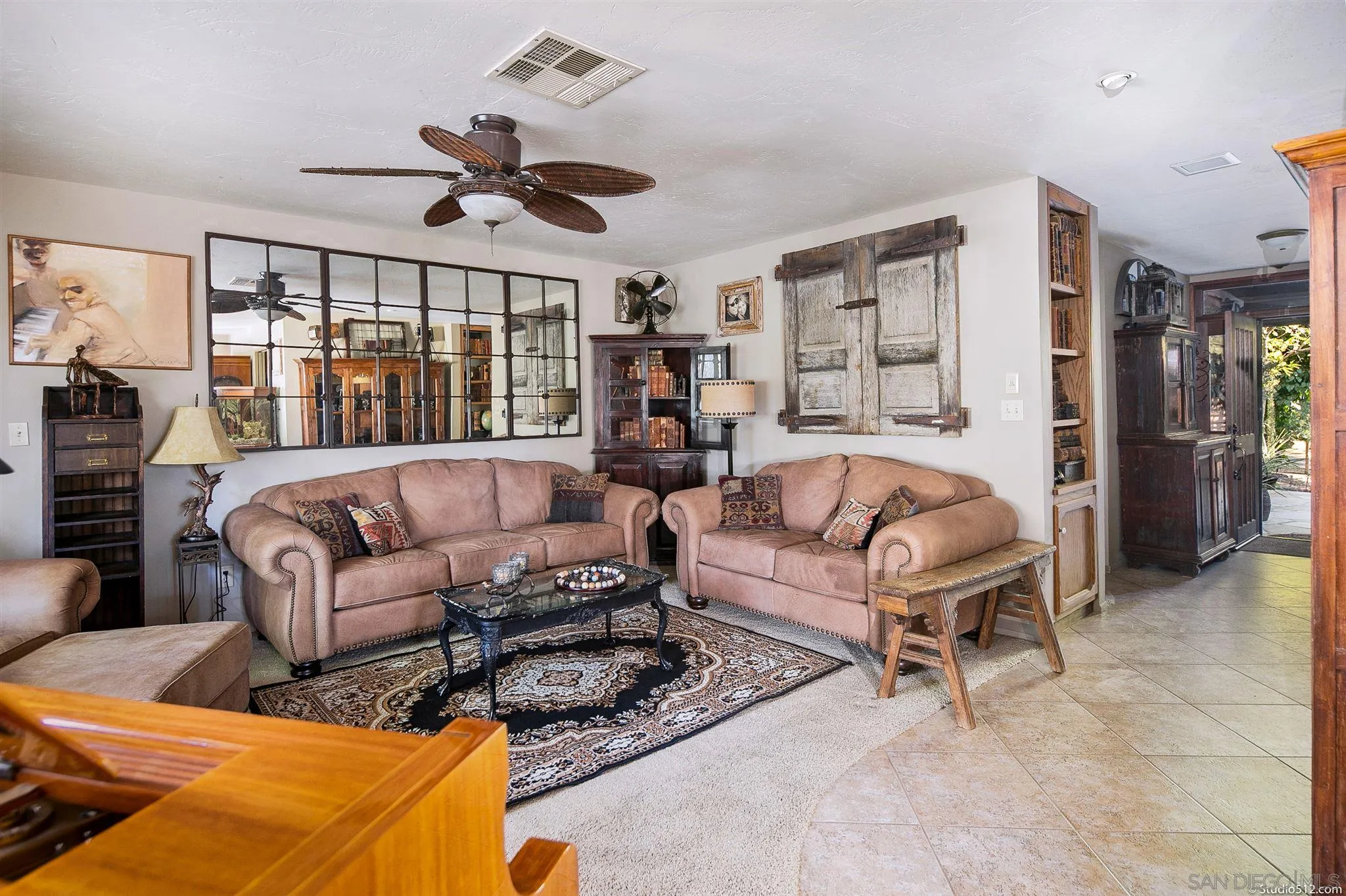 4944 Mountainbrook Road Santa Ysabel, CA 92070 - Photo 8 of 29 a living room with furniture a ceiling fan and a large window