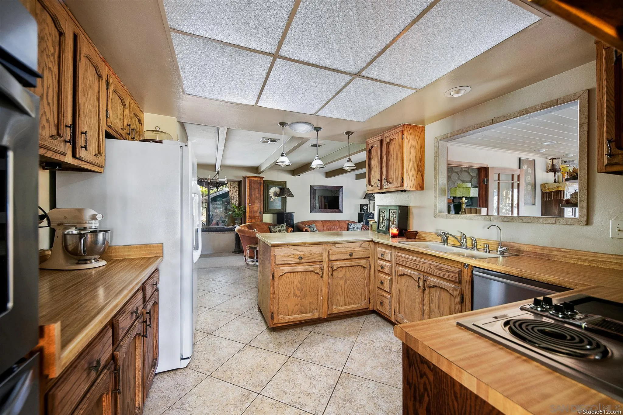 4944 Mountainbrook Road Santa Ysabel, CA 92070 - Photo 10 of 29 a kitchen with stainless steel appliances granite countertop a sink and cabinets