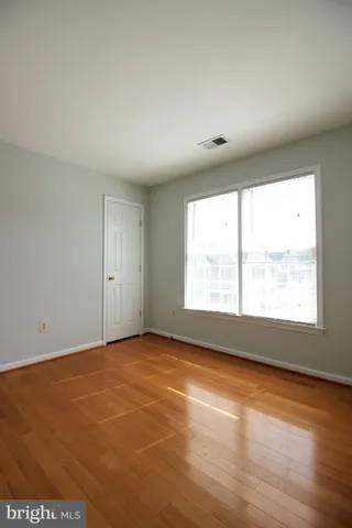an empty room with a empty space and a window