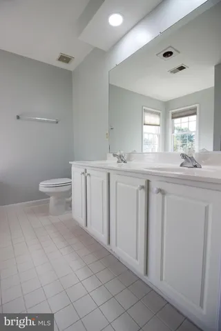 a bath tub sitting in a bathroom next to a window