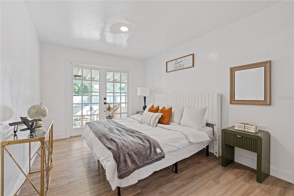 4635 22nd Avenue North St. Petersburg, FL 33713 - Photo 7 of 20 a bedroom with a bed and wooden floor