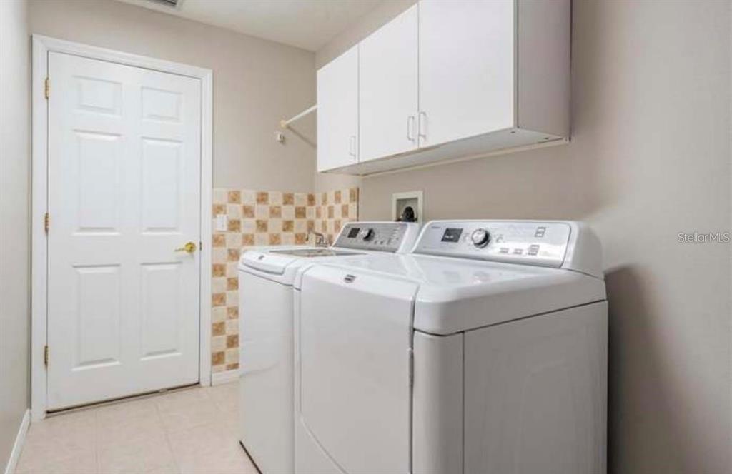 1520 Canberley Court Trinity, FL 34655 - Photo 14 of 35 a utility room with dryer and washer