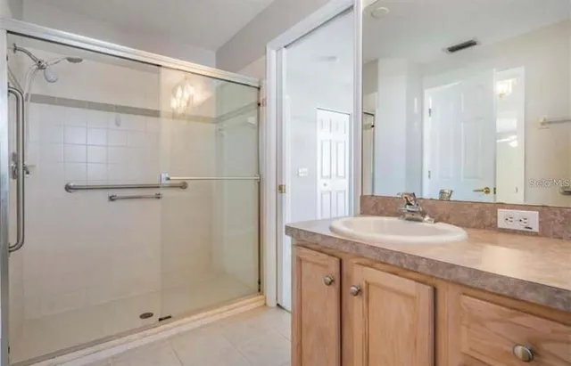 a view of a yard with plants and trees