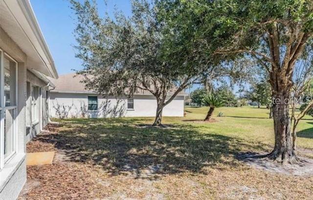 1520 Canberley Court Trinity, FL 34655 - Photo 19 of 35 a view of a yard with plants and trees