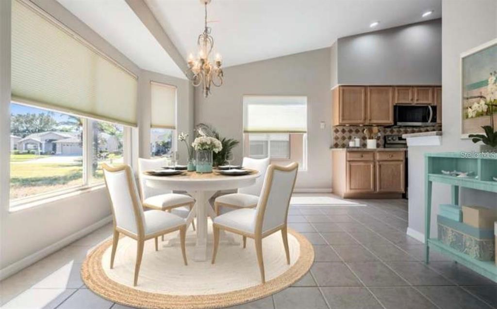 1520 Canberley Court Trinity, FL 34655 - Photo 5 of 35 a dining room with wooden floor a chandelier a wooden table and chairs