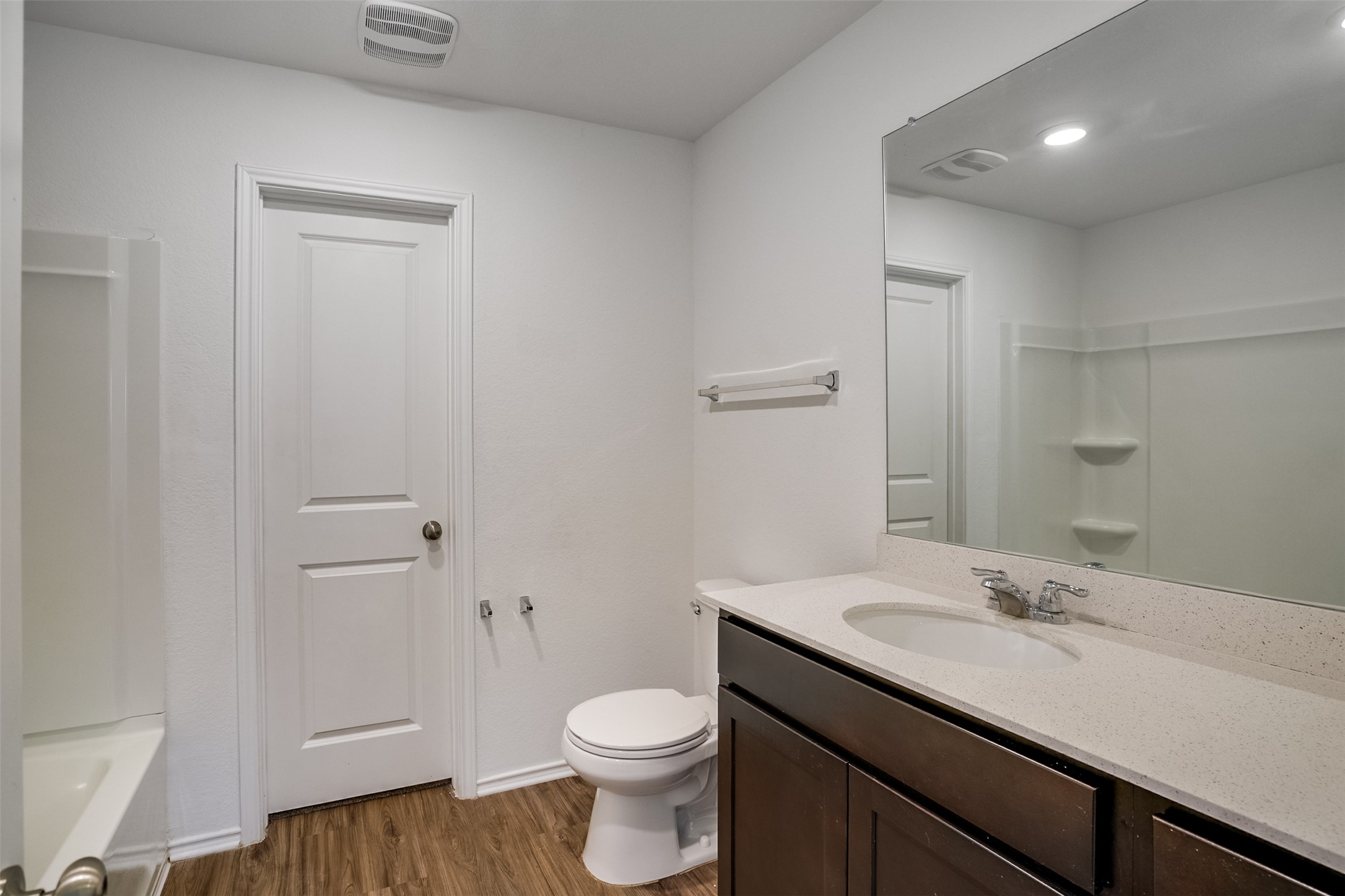 428 Gabbro Gardens Maxwell, TX 78656 - Photo 10 of 26 Full bathroom with vanity and dark wood-style floors