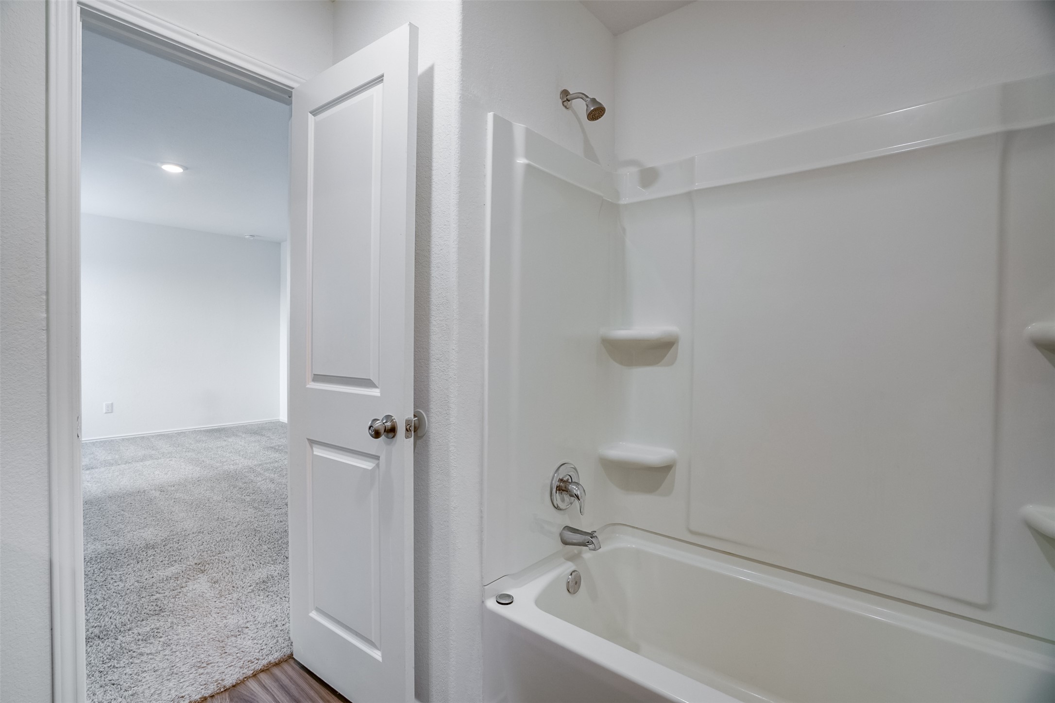 428 Gabbro Gardens Maxwell, TX 78656 - Photo 12 of 26 Bathroom with light carpet and shower / bath combination