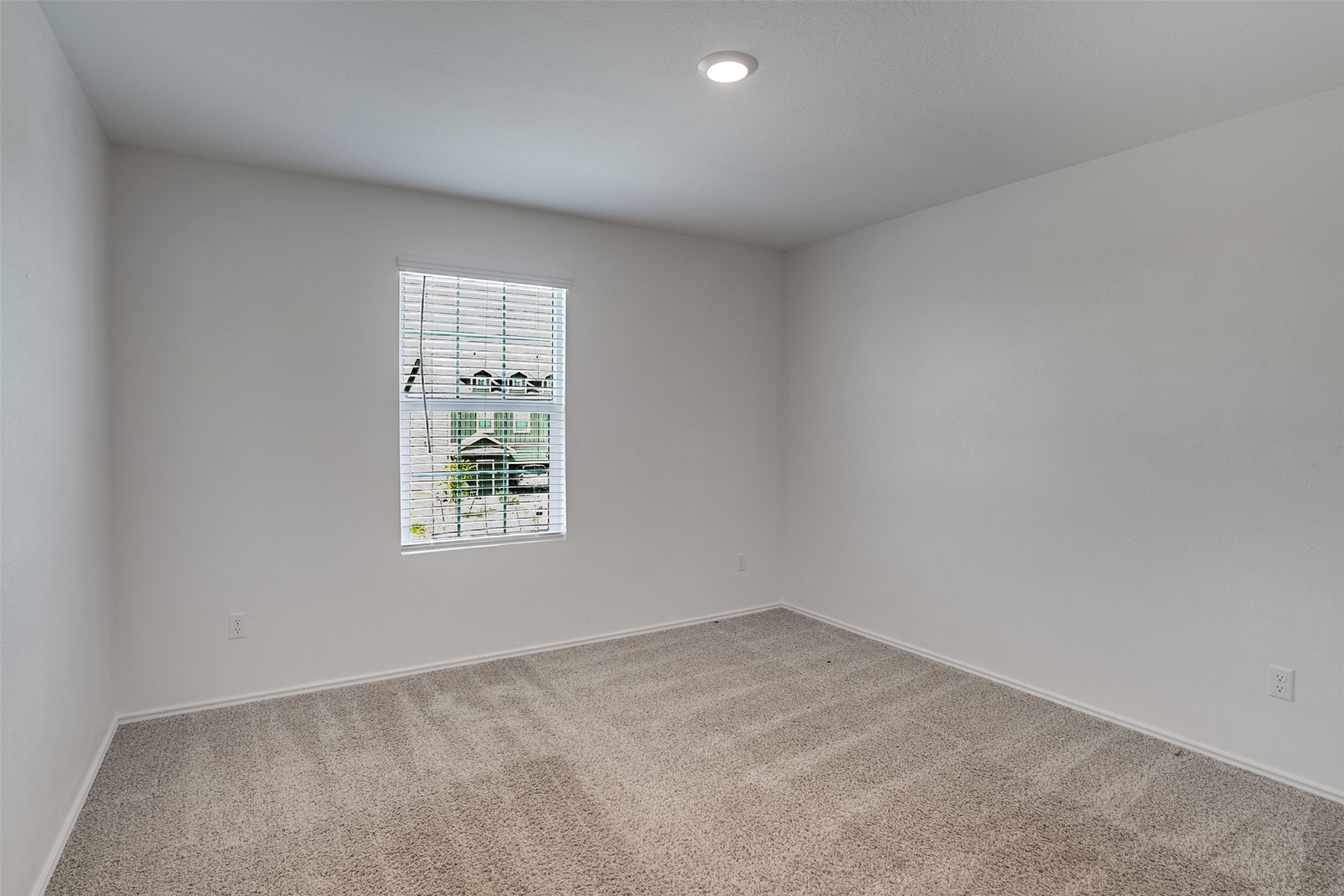 428 Gabbro Gardens Maxwell, TX 78656 - Photo 15 of 26 Spare room with light carpet and baseboards