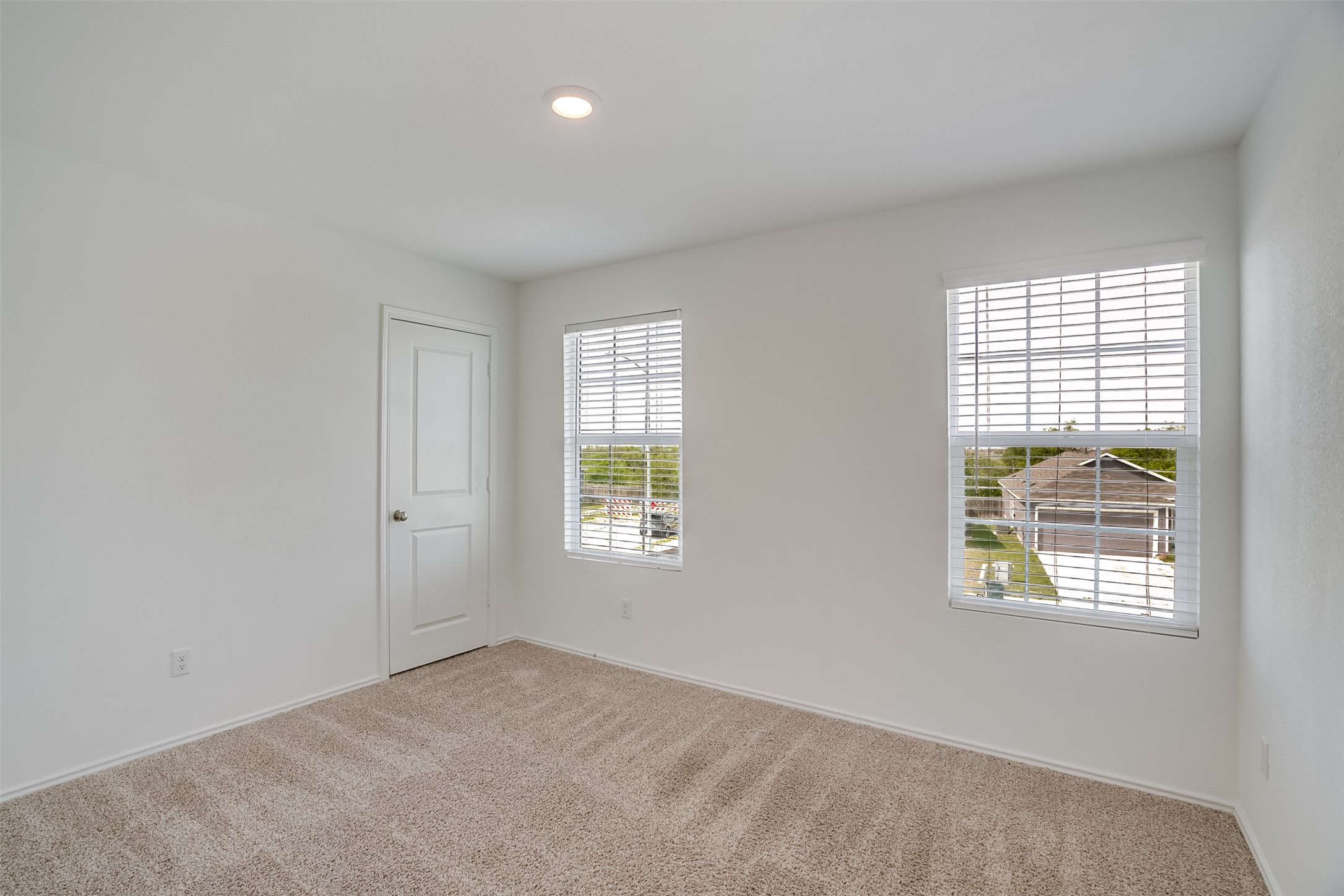 428 Gabbro Gardens Maxwell, TX 78656 - Photo 16 of 26 Carpeted spare room featuring baseboards and recessed lighting