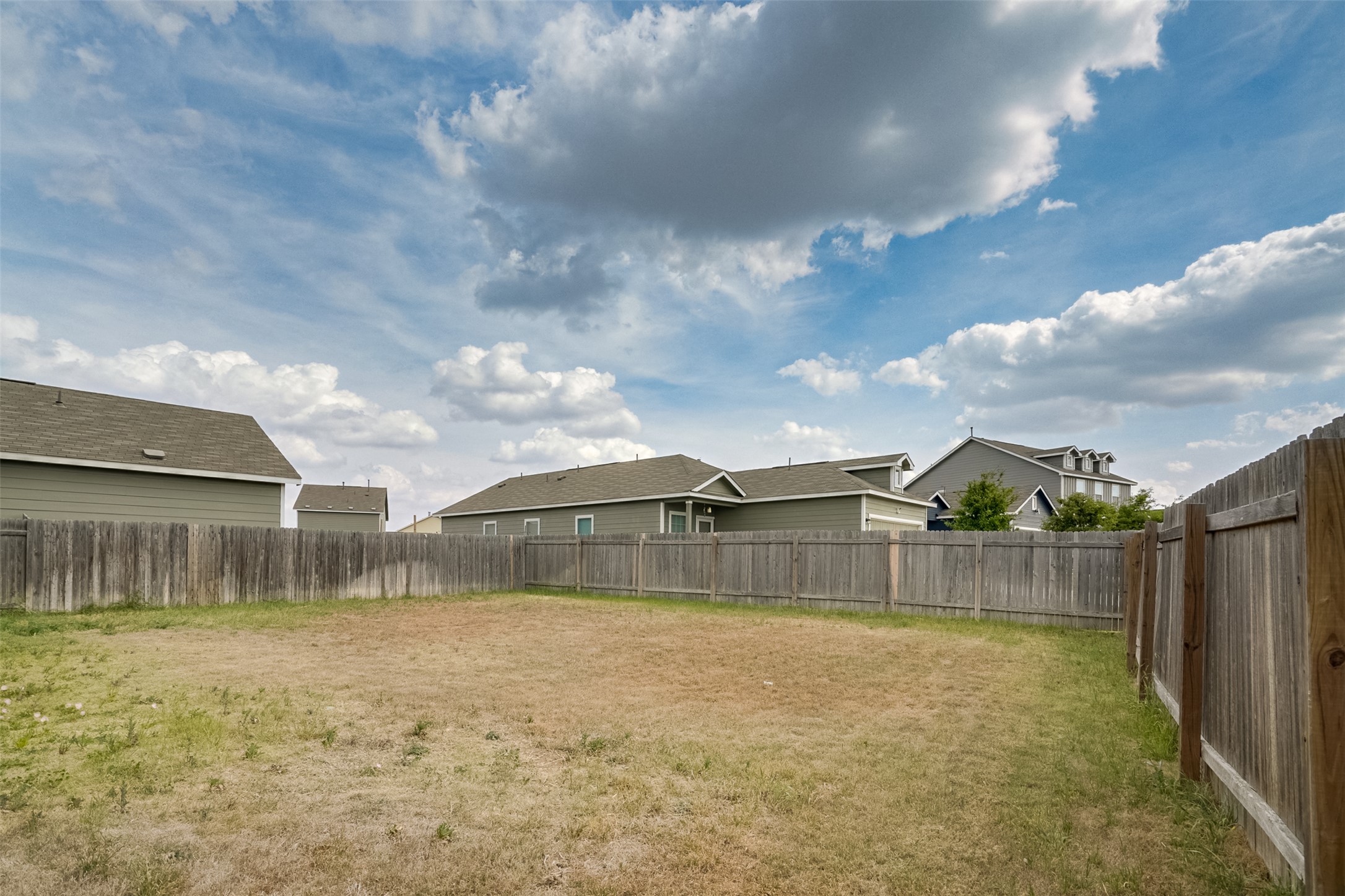 428 Gabbro Gardens Maxwell, TX 78656 - Photo 2 of 26 Fenced backyard featuring a residential view