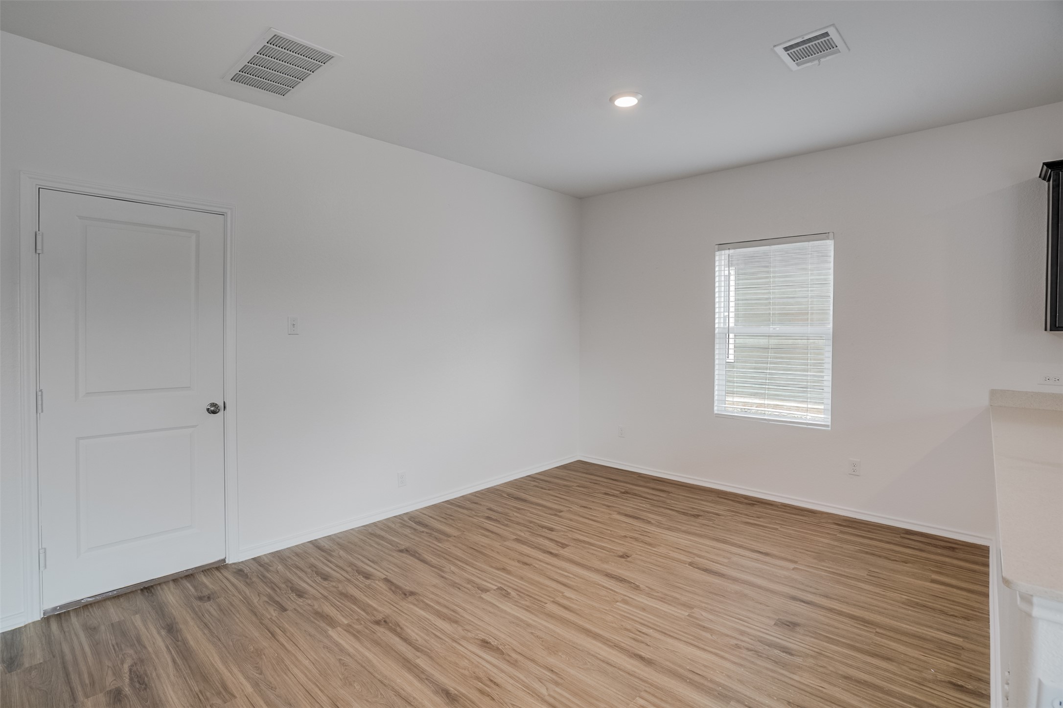 428 Gabbro Gardens Maxwell, TX 78656 - Photo 7 of 26 Spare room featuring light wood finished floors and recessed lighting