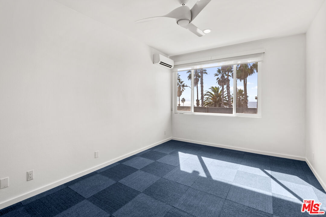 2221 Ocean Avenue, Unit 205 Santa Monica, CA 90405 - Photo 11 of 16 an empty room with a window and ceiling fan