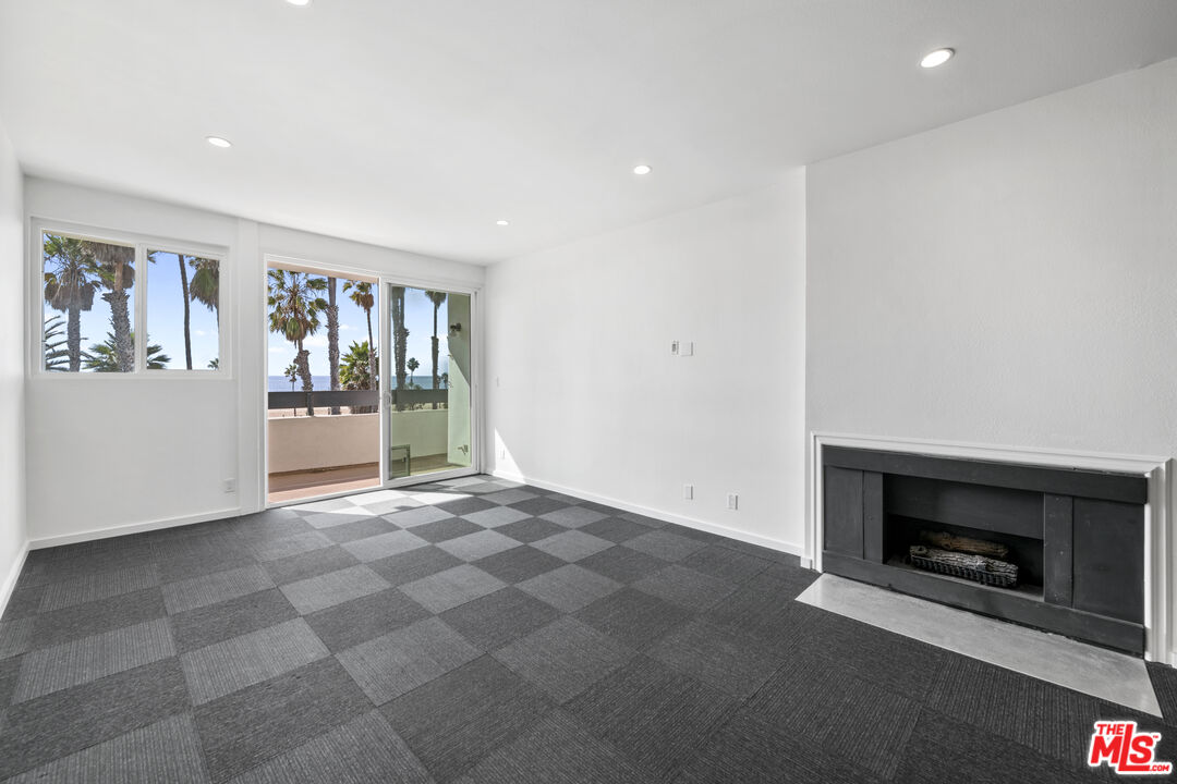 2221 Ocean Avenue, Unit 205 Santa Monica, CA 90405 - Photo 2 of 16 a view of an empty room with a fireplace