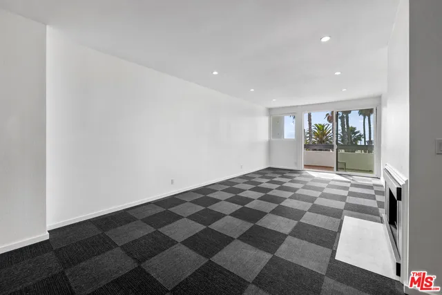 a view of a room with a black and white checkered floor