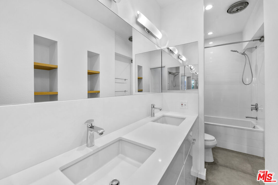 2221 Ocean Avenue, Unit 205 Santa Monica, CA 90405 - Photo 10 of 16 a bathroom with a sink a toilet and shower